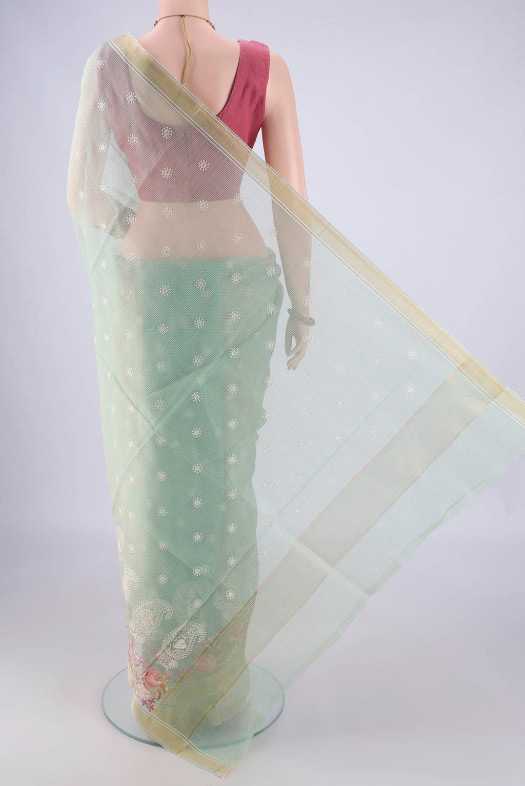 Flat view of Mint Green Blended Kota Cotton Saree with Embroidery on the body and Zari Border. 