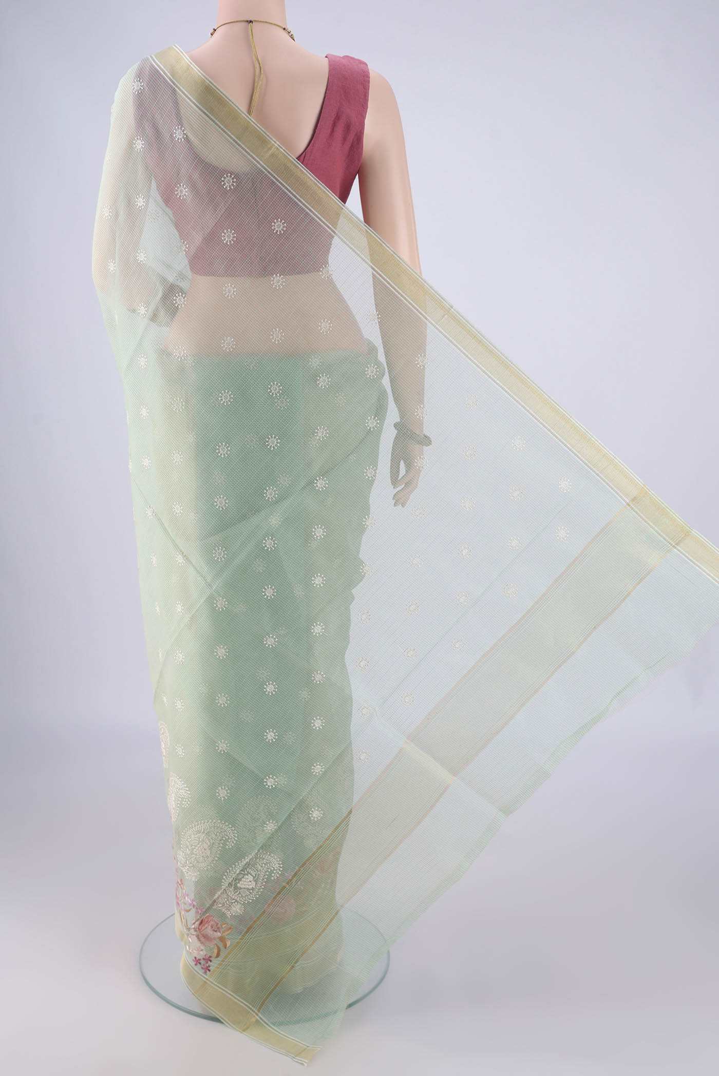 Flat view of Mint Green Blended Kota Cotton Saree with Embroidery on the body and Zari Border. 