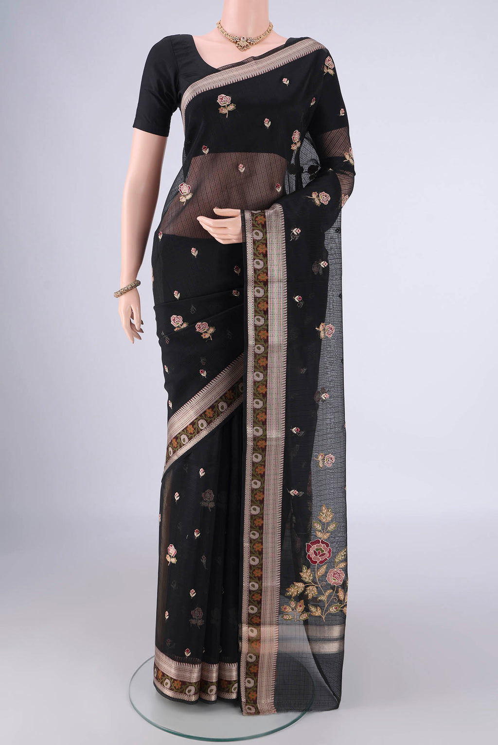 Black Blended Kota Cotton Saree with Embroidery on the body and Zari Border.  displayed on a mannequin