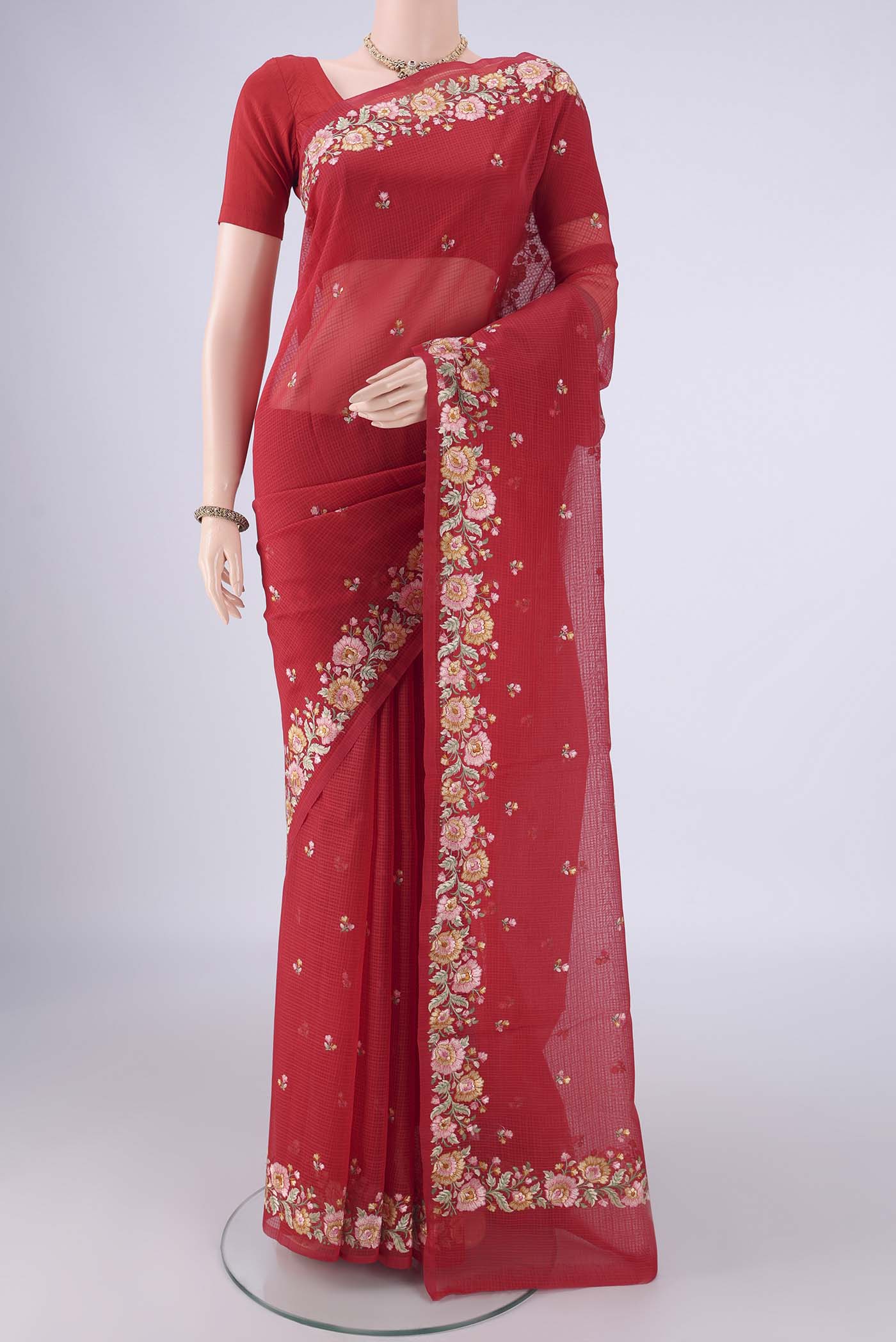 Red Blended Kota Cotton Saree with Embroidery on the body and Thread Border.  displayed on a mannequin