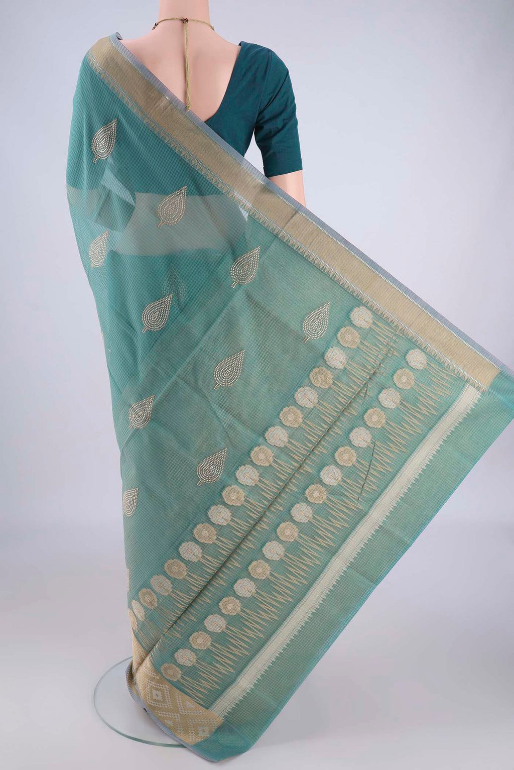 Flat view of Sea Green Blended Kota Cotton Saree with Embroidery on the body and Zari Border. 