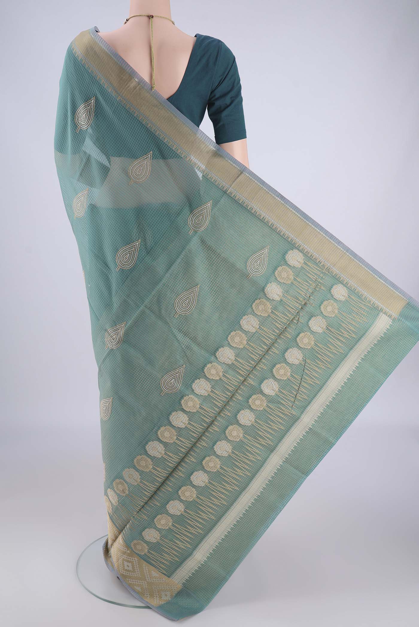 Flat view of Sea Green Blended Kota Cotton Saree with Embroidery on the body and Zari Border. 