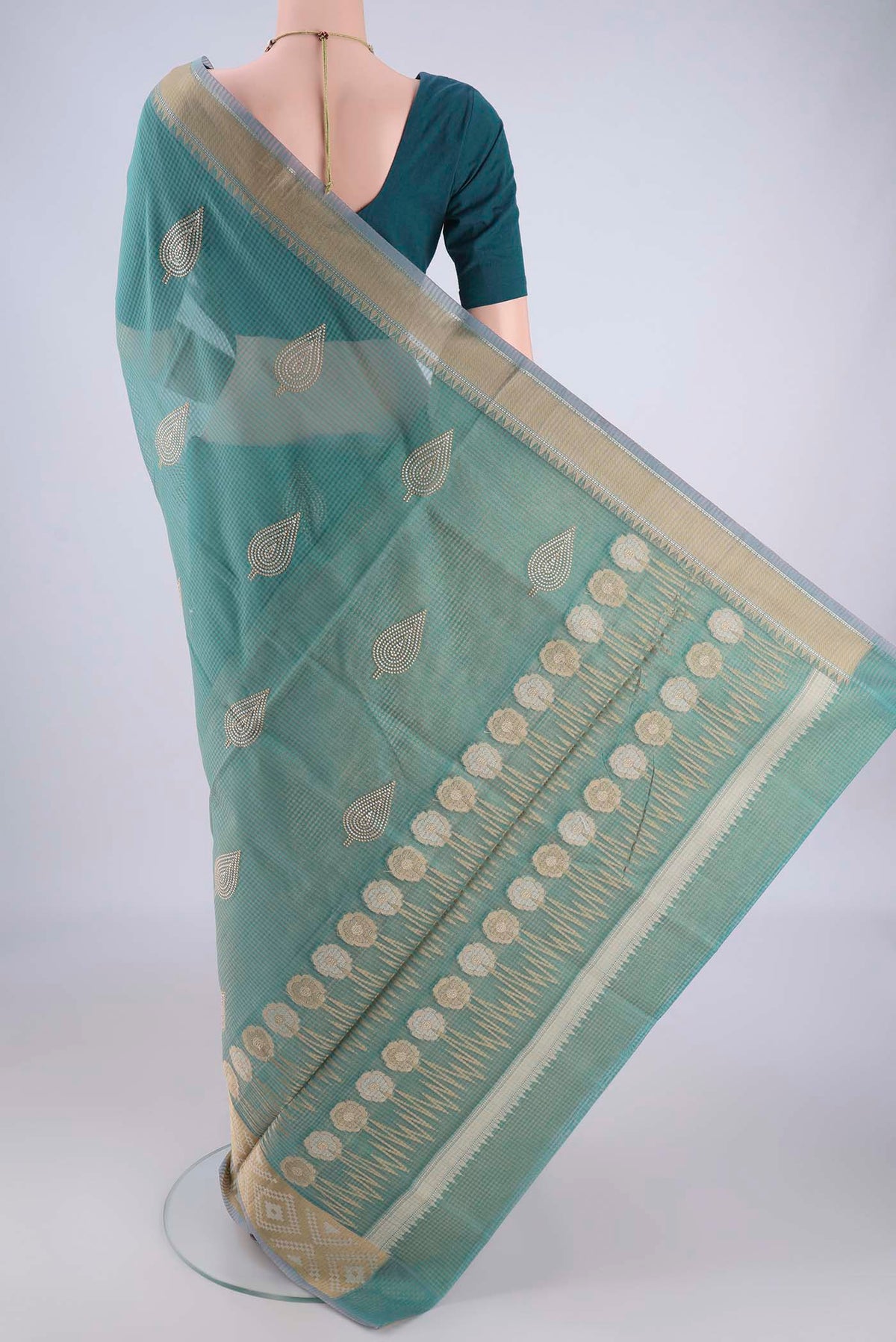 Flat view of Sea Green Blended Kota Cotton Saree with Embroidery on the body and Zari Border. 