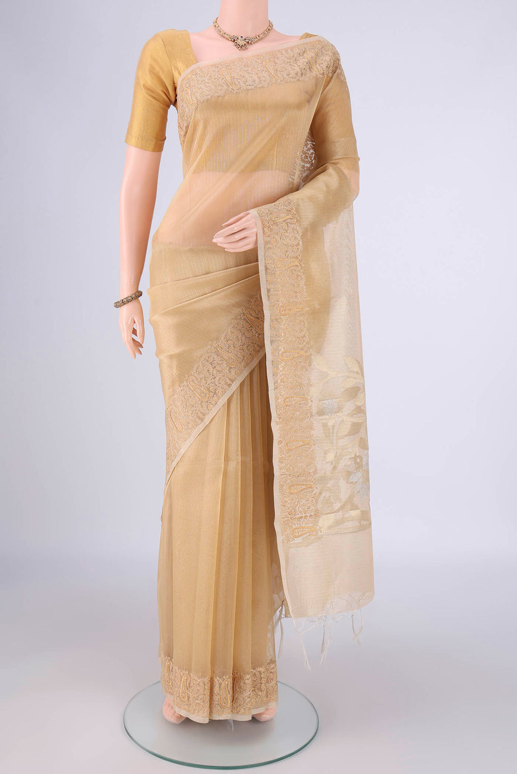 Golden Blended Kota Cotton Saree with Stripes on the body and Embroidery Border.  displayed on a mannequin