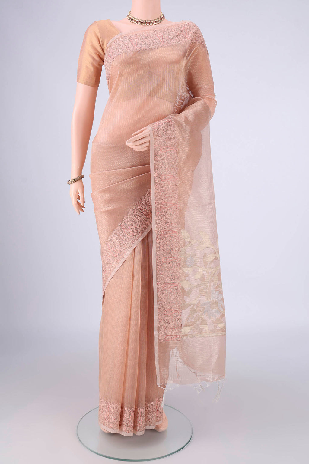 Rose Gold Blended Kota Cotton Saree with Plain Body and Embroidery Border.  displayed on a mannequin