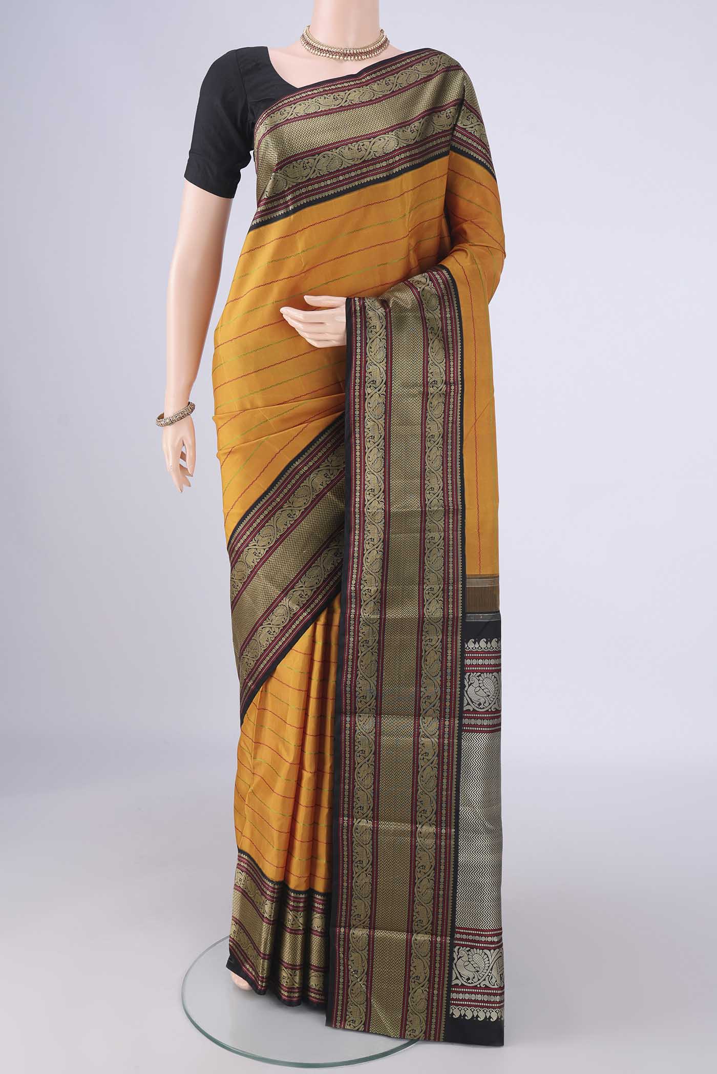 Mustard Dual Tone Kanjivaram Silk Saree with Veldhari on the body and Thread Border.  displayed on a mannequin