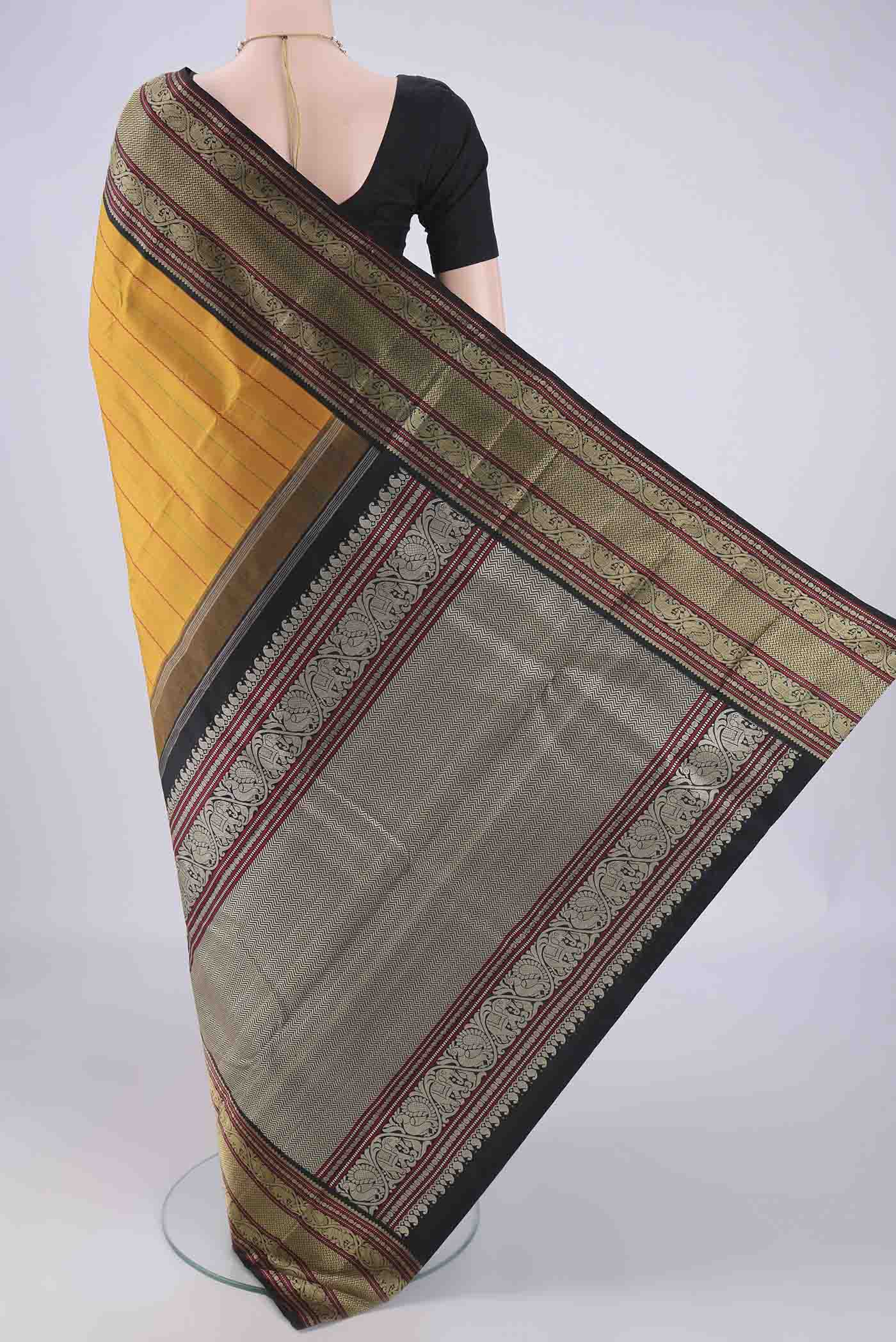 Flat view of Mustard Dual Tone Kanjivaram Silk Saree with Veldhari on the body and Thread Border. 