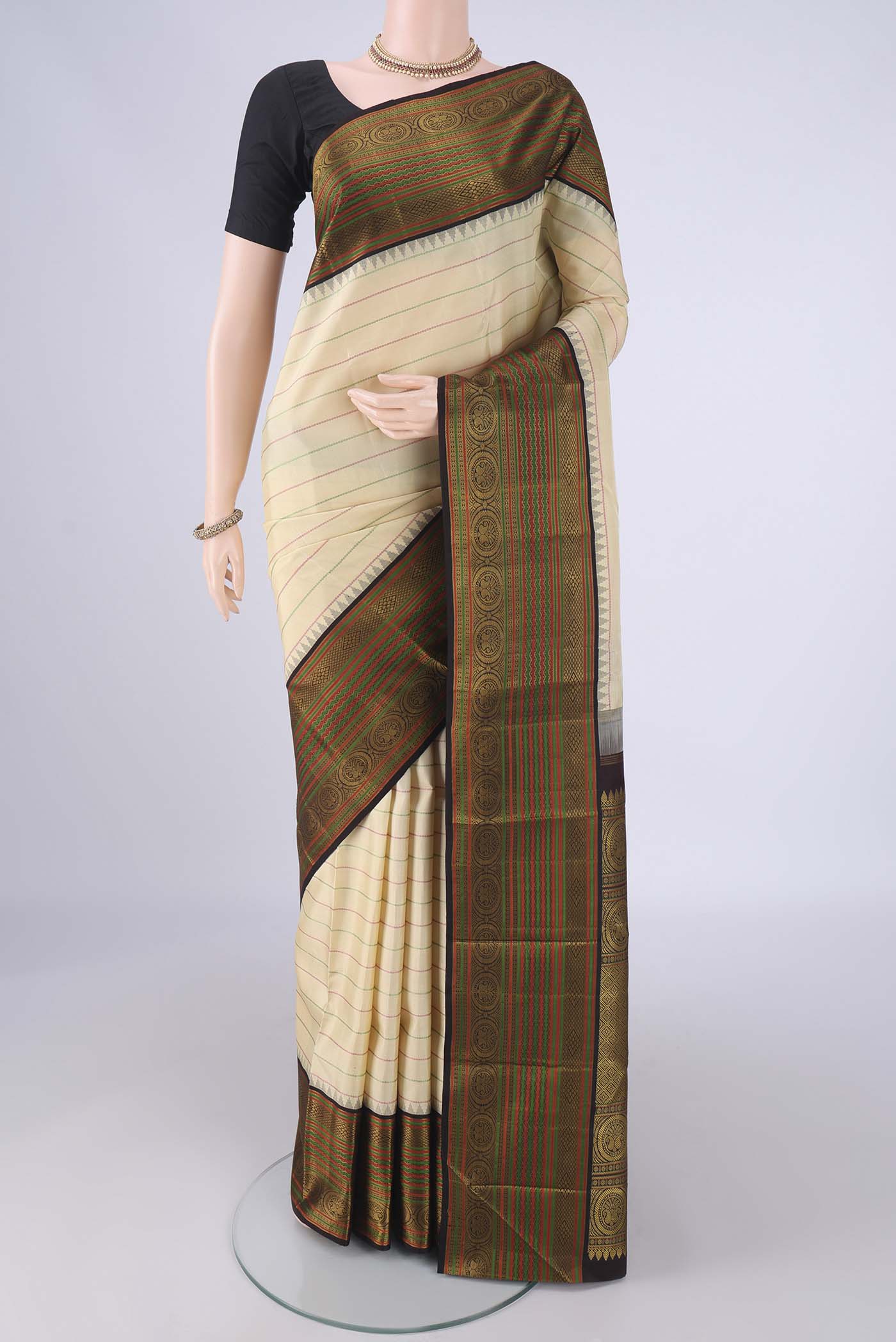 Cream Dual Tone Kanjivaram Silk Saree with Veldhari on the body and Thread Border.  displayed on a mannequin