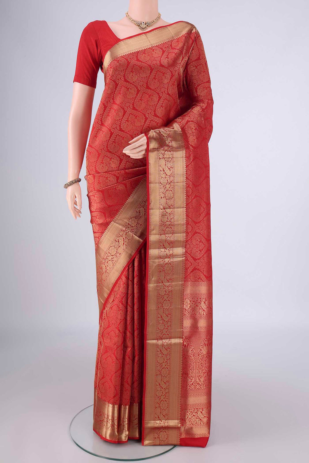 Red Soft Silk Saree with Zari Brocade on the body and Zari Border.  displayed on a mannequin