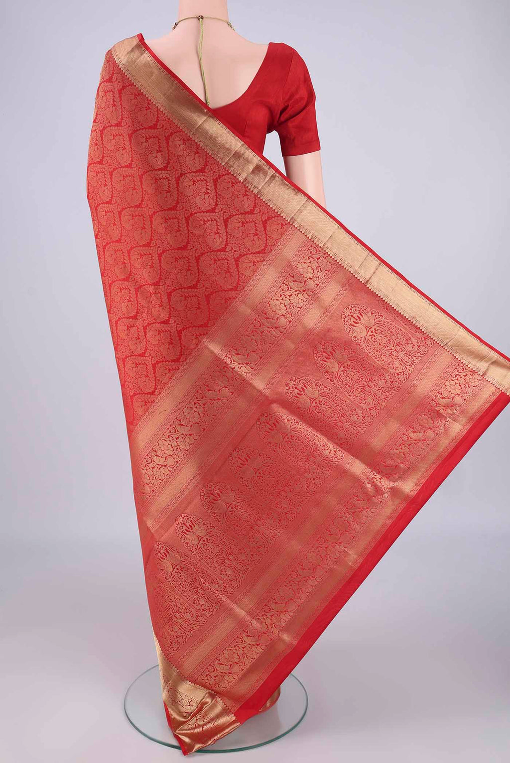Flat view of Red Soft Silk Saree with Zari Brocade on the body and Zari Border. 