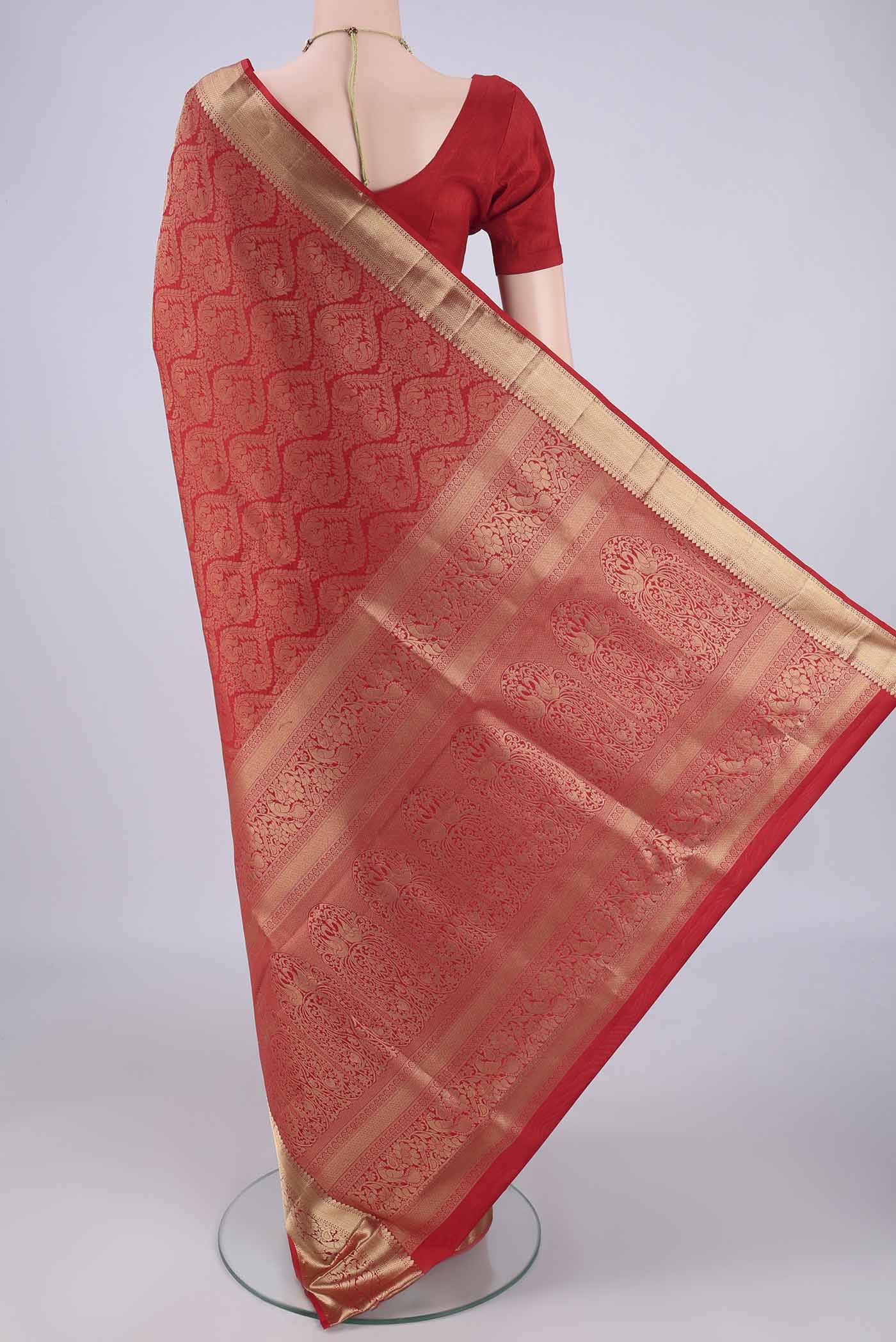 Flat view of Red Soft Silk Saree with Zari Brocade on the body and Zari Border. 
