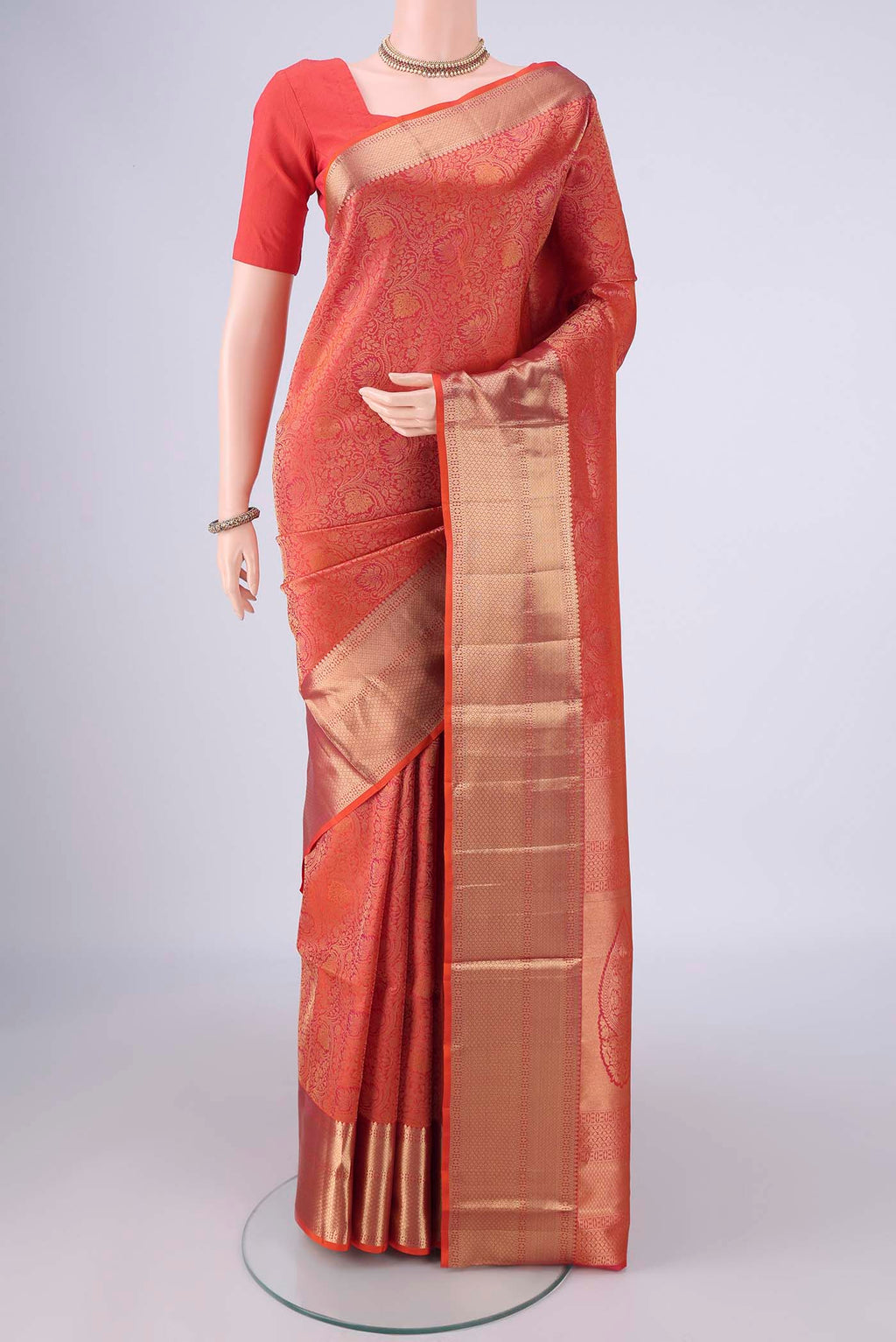 Orange Dual Tone Soft Silk Saree with Zari Brocade on the body and Zari Border.  displayed on a mannequin