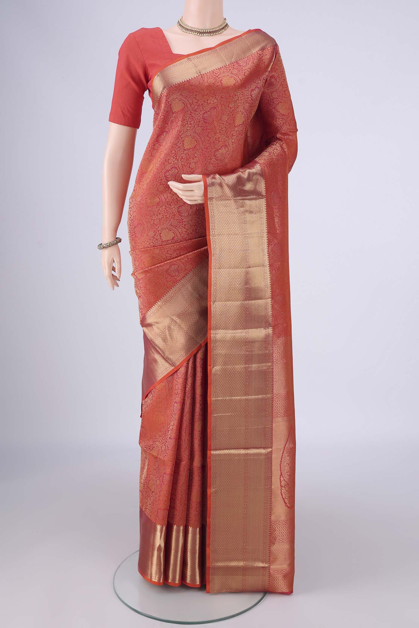 Orange Dual Tone Soft Silk Saree with Zari Brocade on the body and Zari Border.  displayed on a mannequin