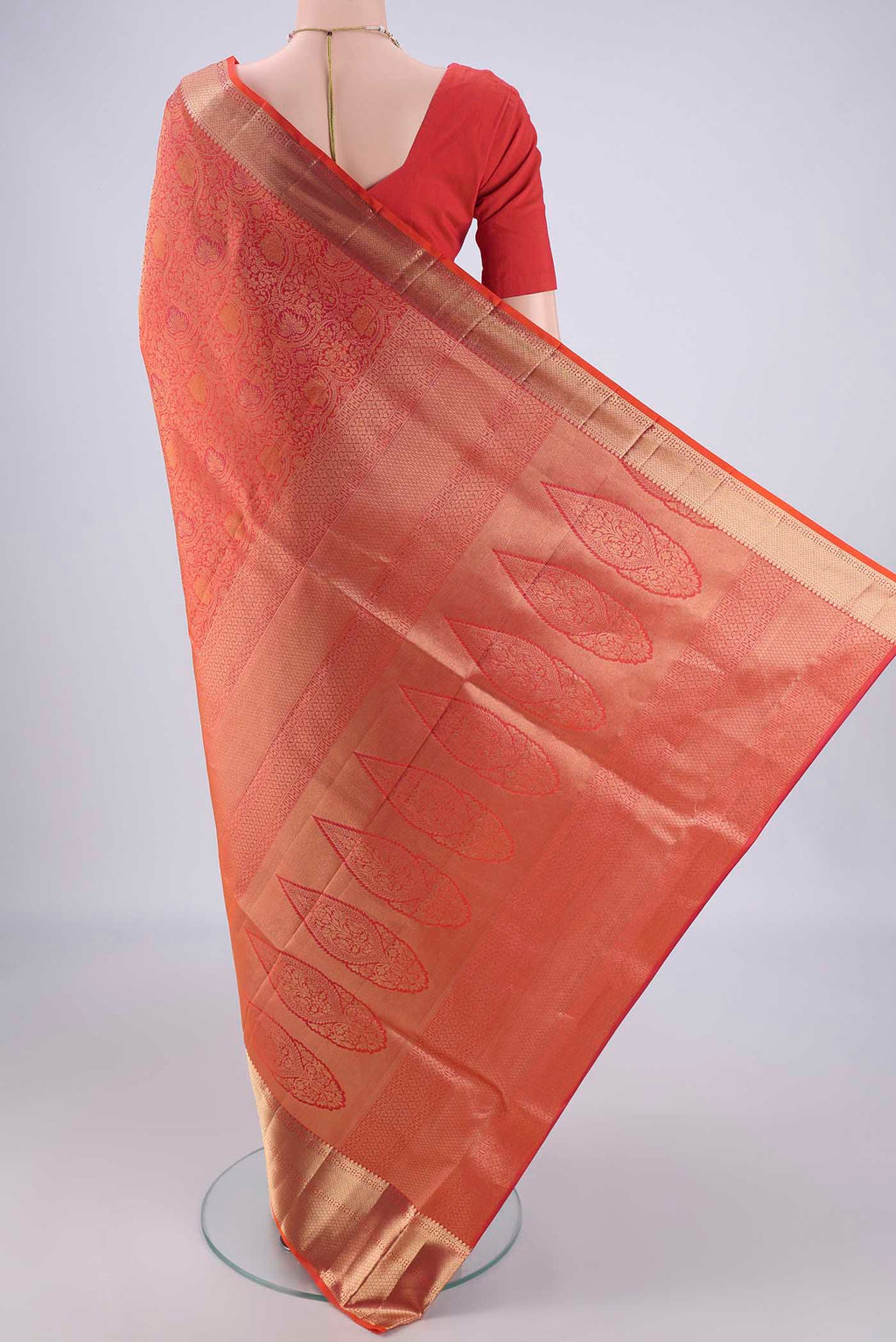 Flat view of Orange Dual Tone Soft Silk Saree with Zari Brocade on the body and Zari Border. 