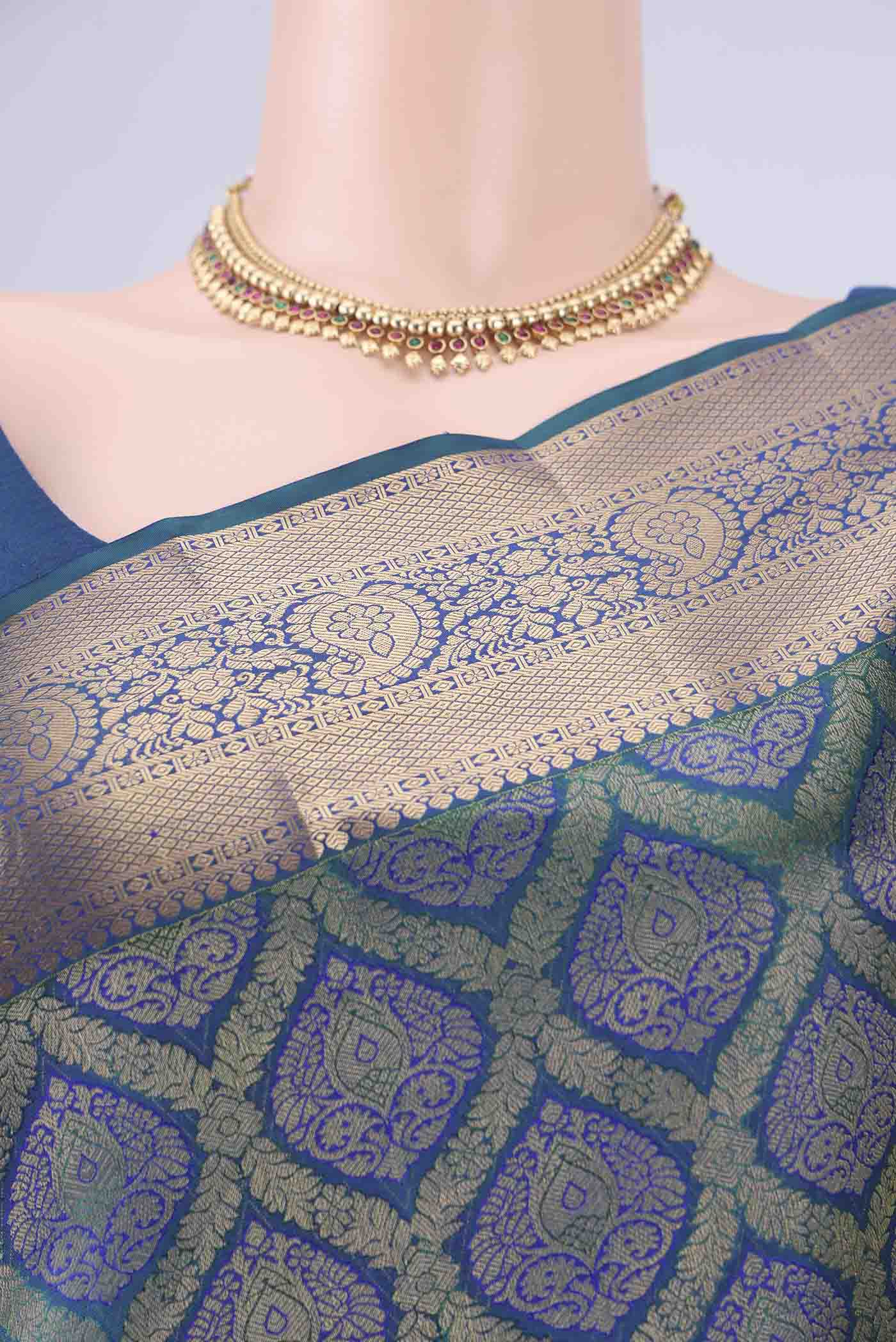 Border image of Peacock Blue Soft Silk Saree with Zari Brocade on the body and Zari Border. 