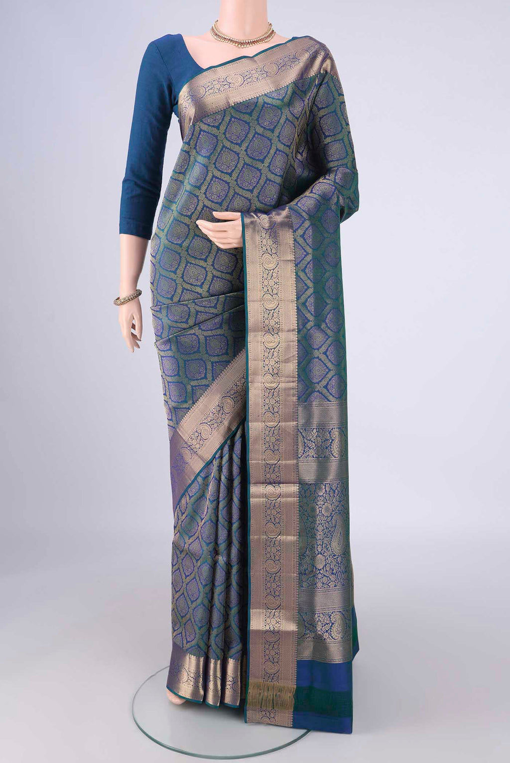 Peacock Blue Soft Silk Saree with Zari Brocade on the body and Zari Border.  displayed on a mannequin