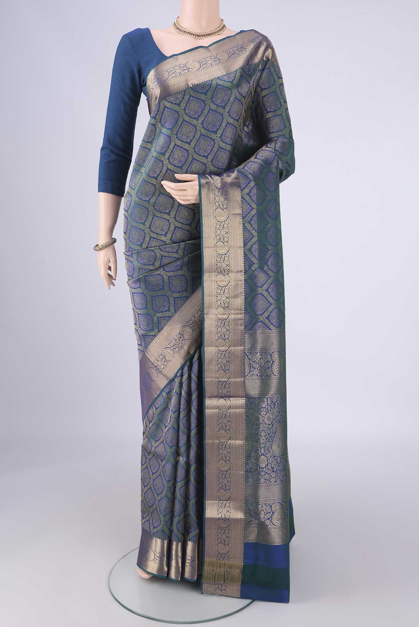 Peacock Blue Soft Silk Saree with Zari Brocade on the body and Zari Border.  displayed on a mannequin