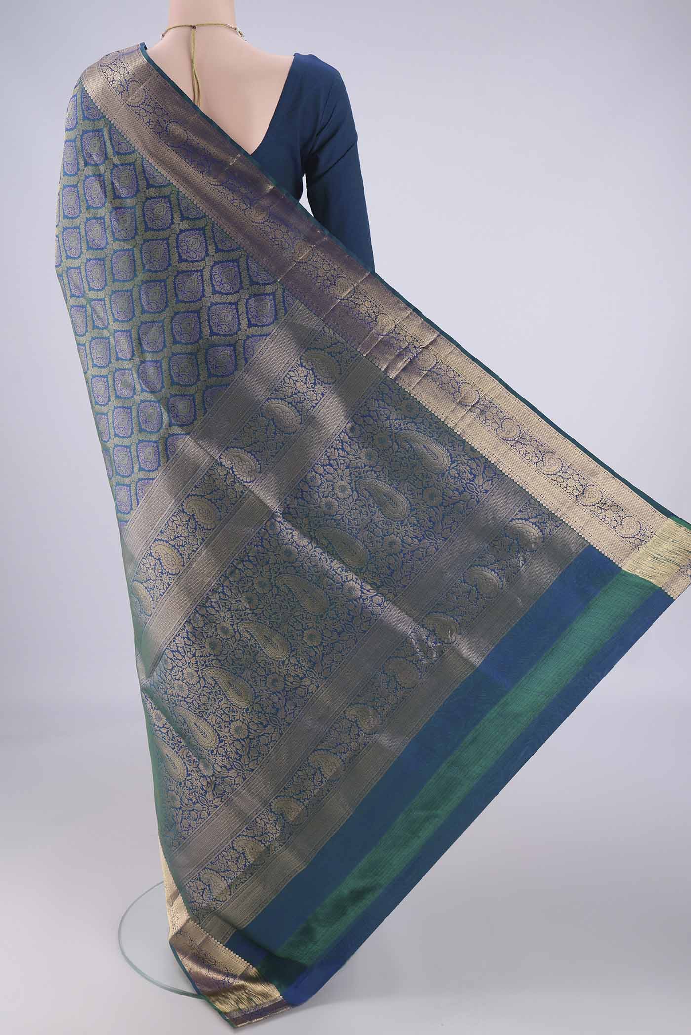 Flat view of Peacock Blue Soft Silk Saree with Zari Brocade on the body and Zari Border. 
