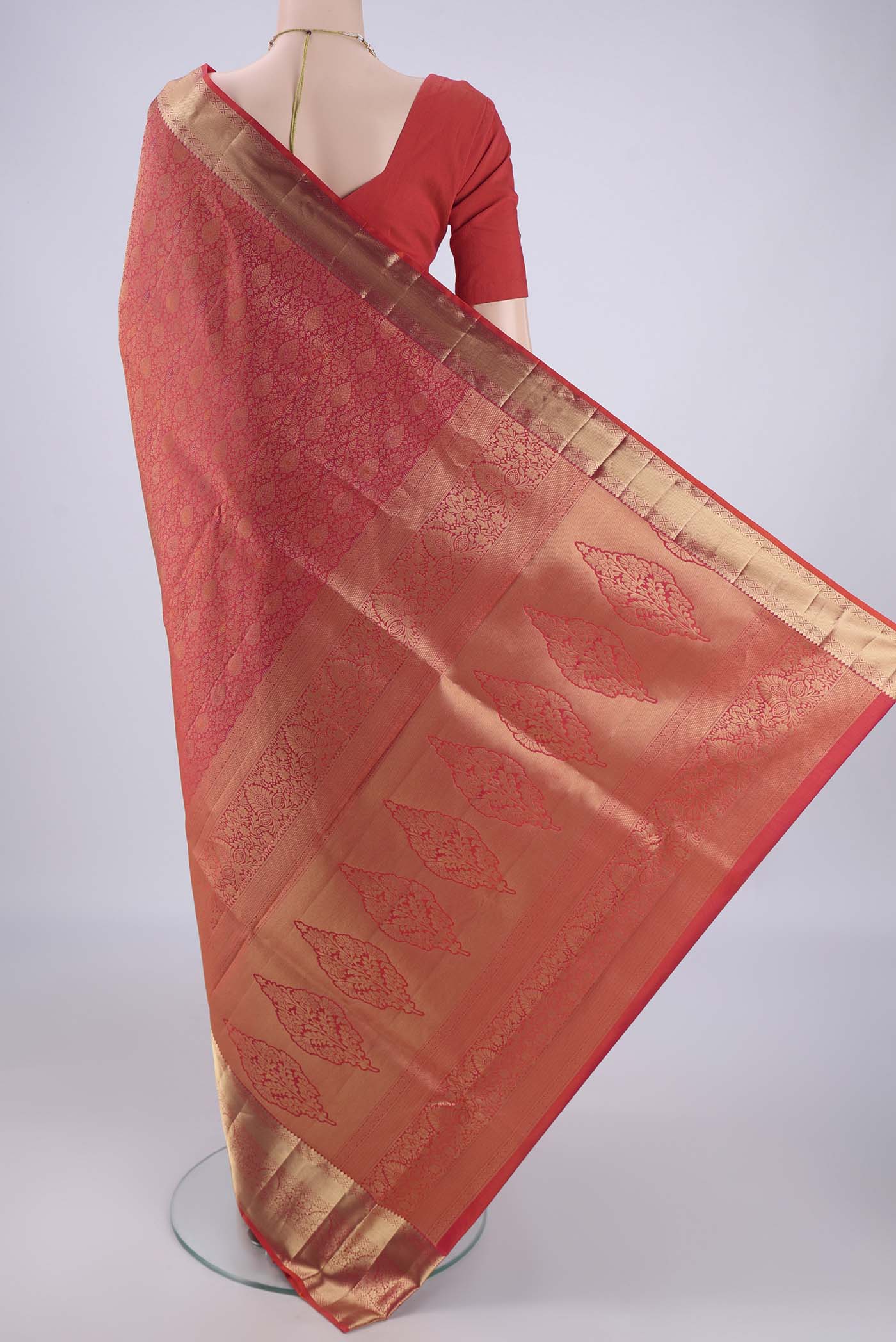 Flat view of Orange Soft Silk Saree with Zari Brocade on the body and Zari Border. 