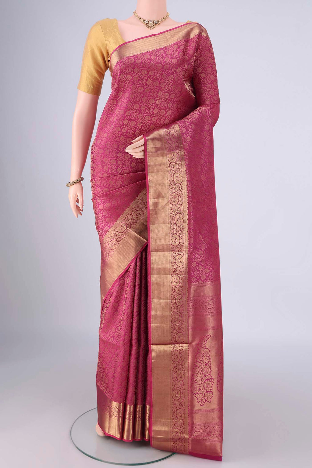 Dark Pink Soft Silk Saree with Zari Brocade on the body and Zari Border.  displayed on a mannequin