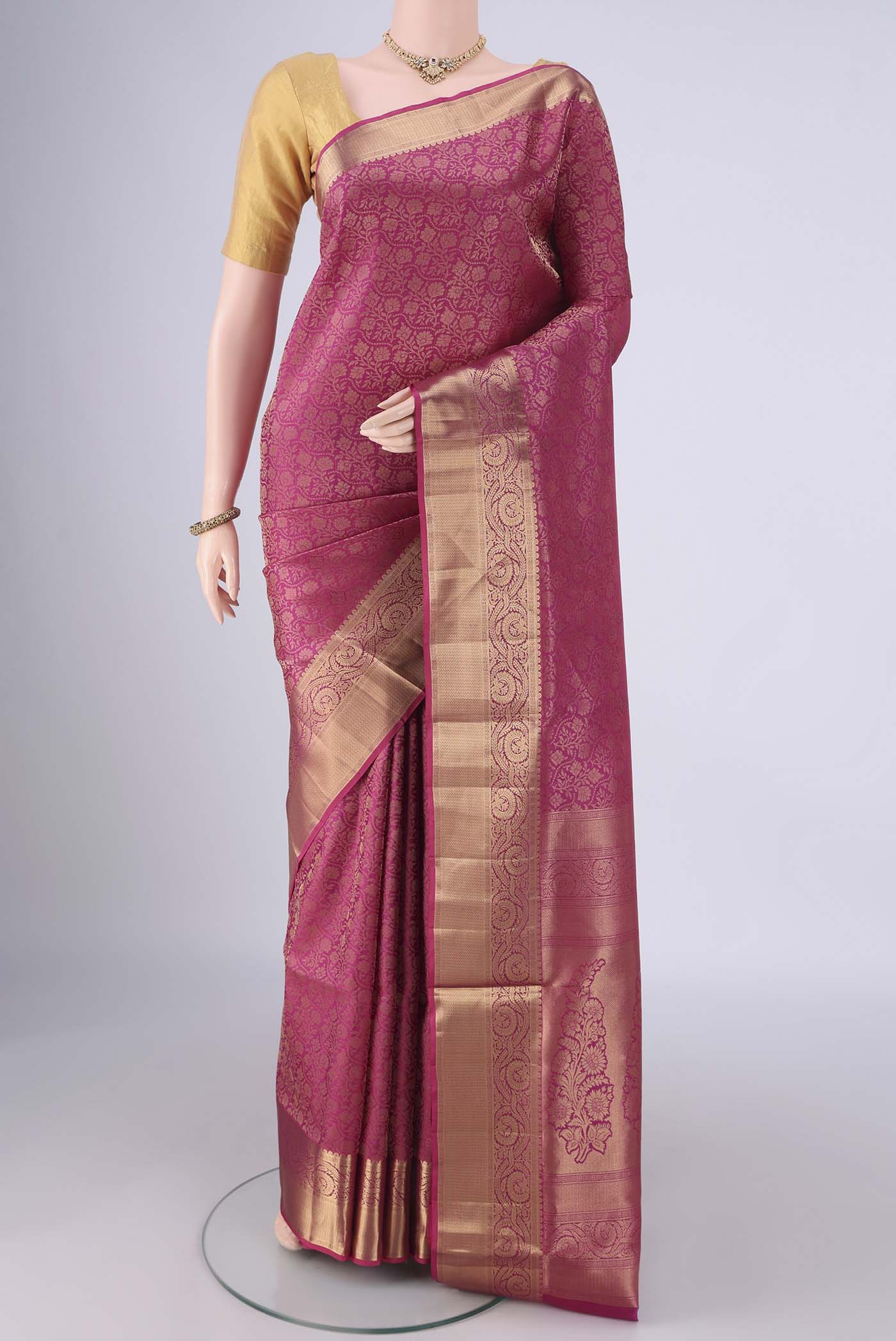 Dark Pink Soft Silk Saree with Zari Brocade on the body and Zari Border.  displayed on a mannequin