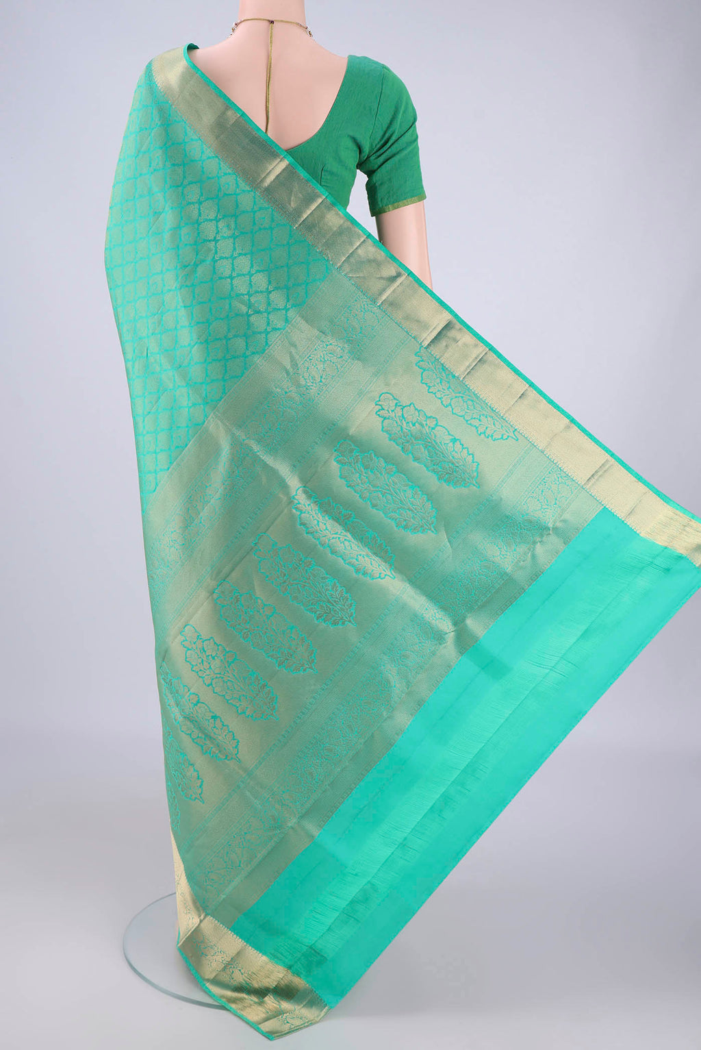 Flat view of Sea Green Soft Silk Saree with Zari Brocade on the body and Zari Border. 