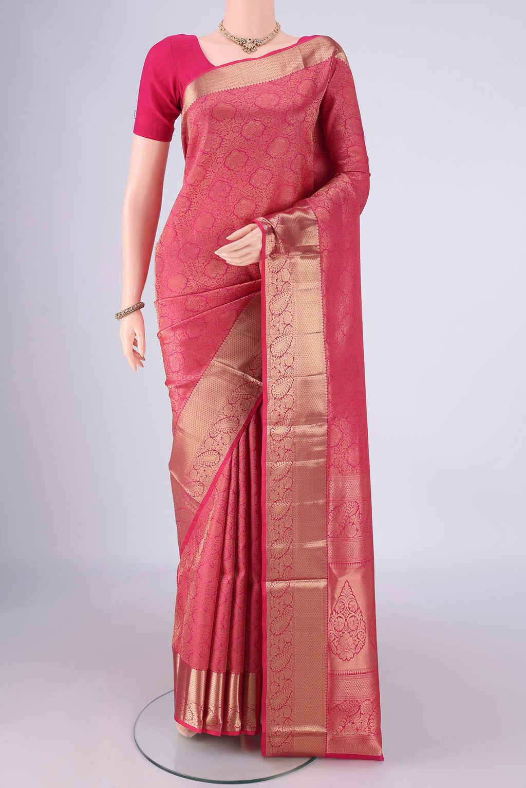 Dark Pink Soft Silk Saree with Zari Brocade on the body and Zari Border.  displayed on a mannequin