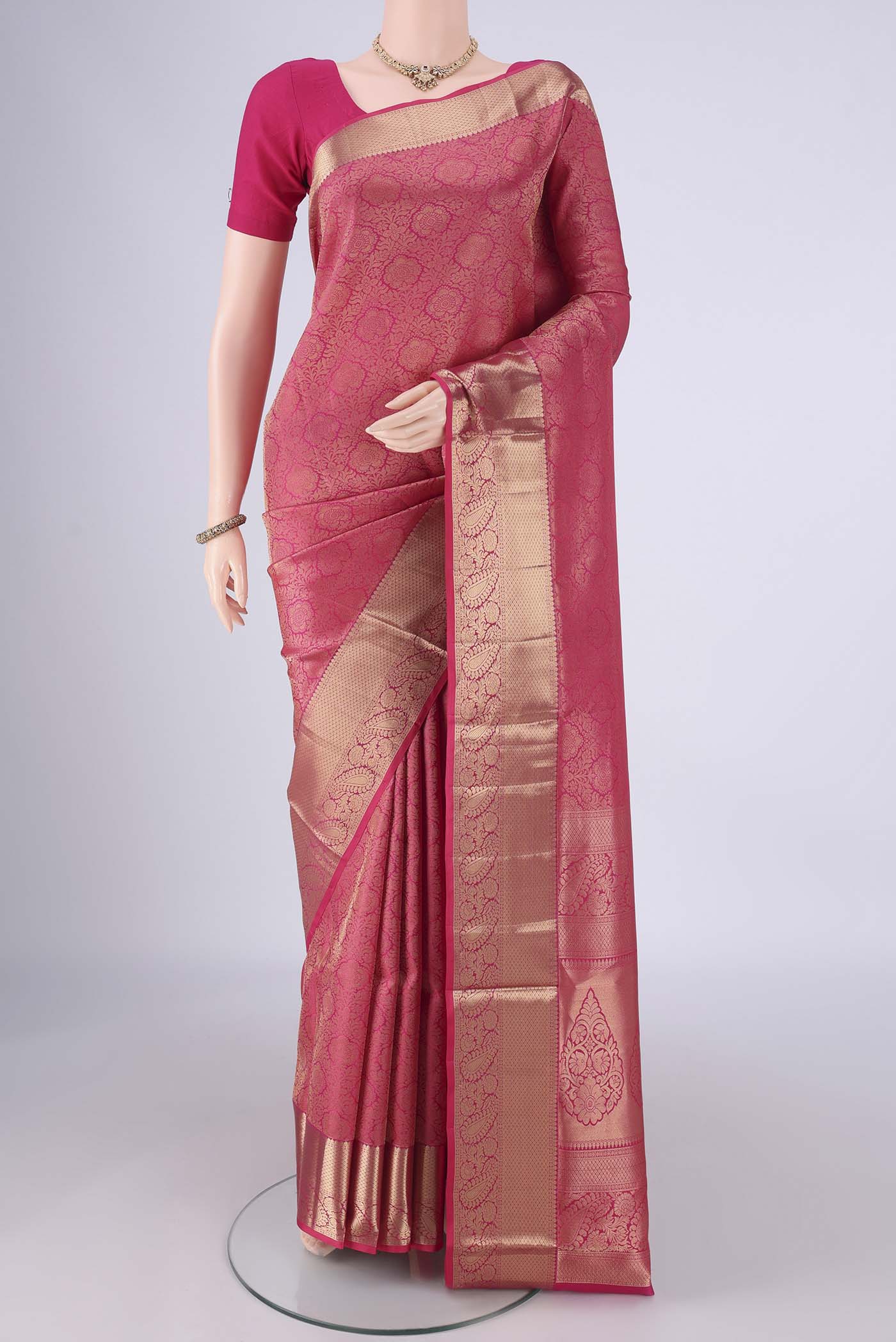 Dark Pink Soft Silk Saree with Zari Brocade on the body and Zari Border.  displayed on a mannequin