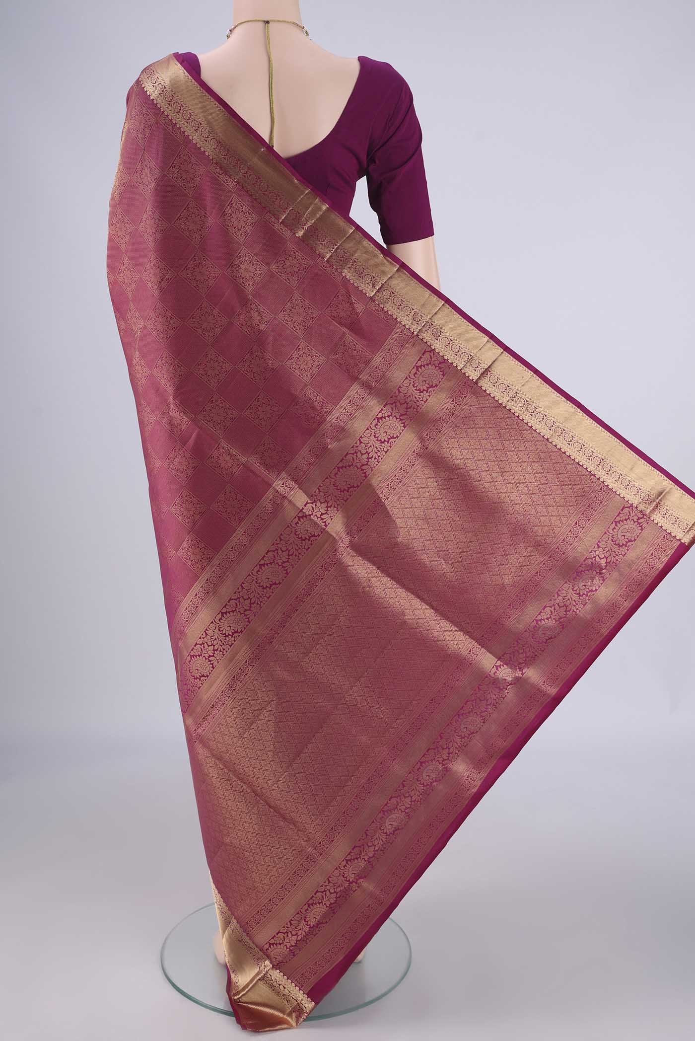Flat view of Bottle Green Soft Silk Saree with Zari Brocade on the body and Zari Border. 