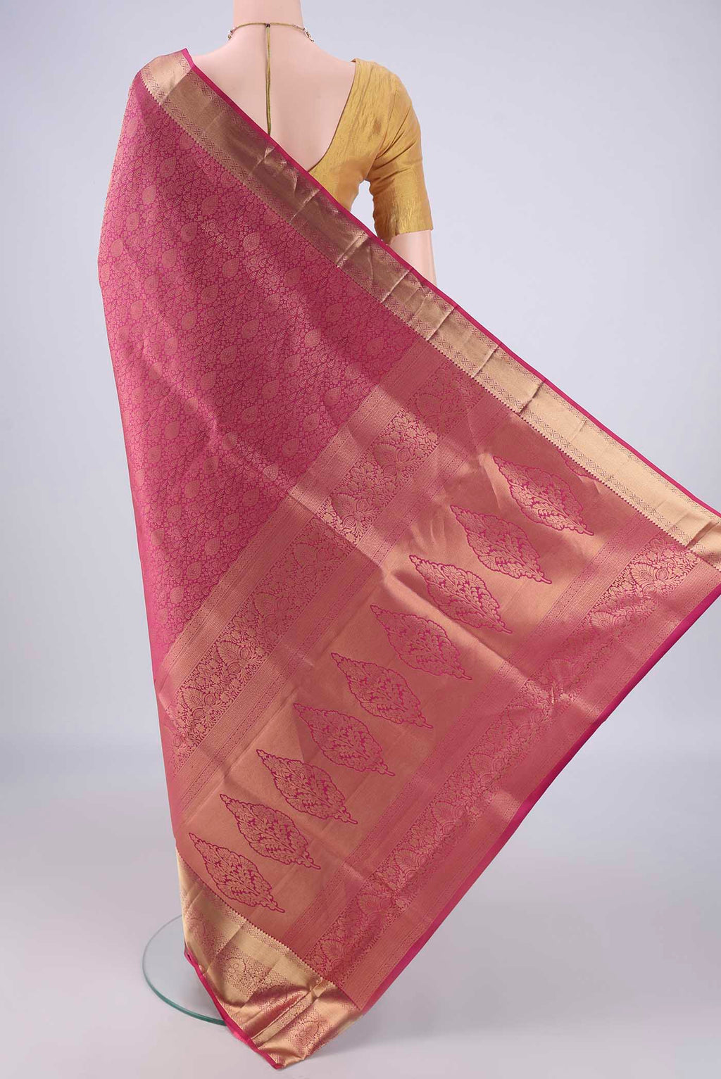Flat view of Dark Pink Soft Silk Saree with Zari Brocade on the body and Zari Border. 