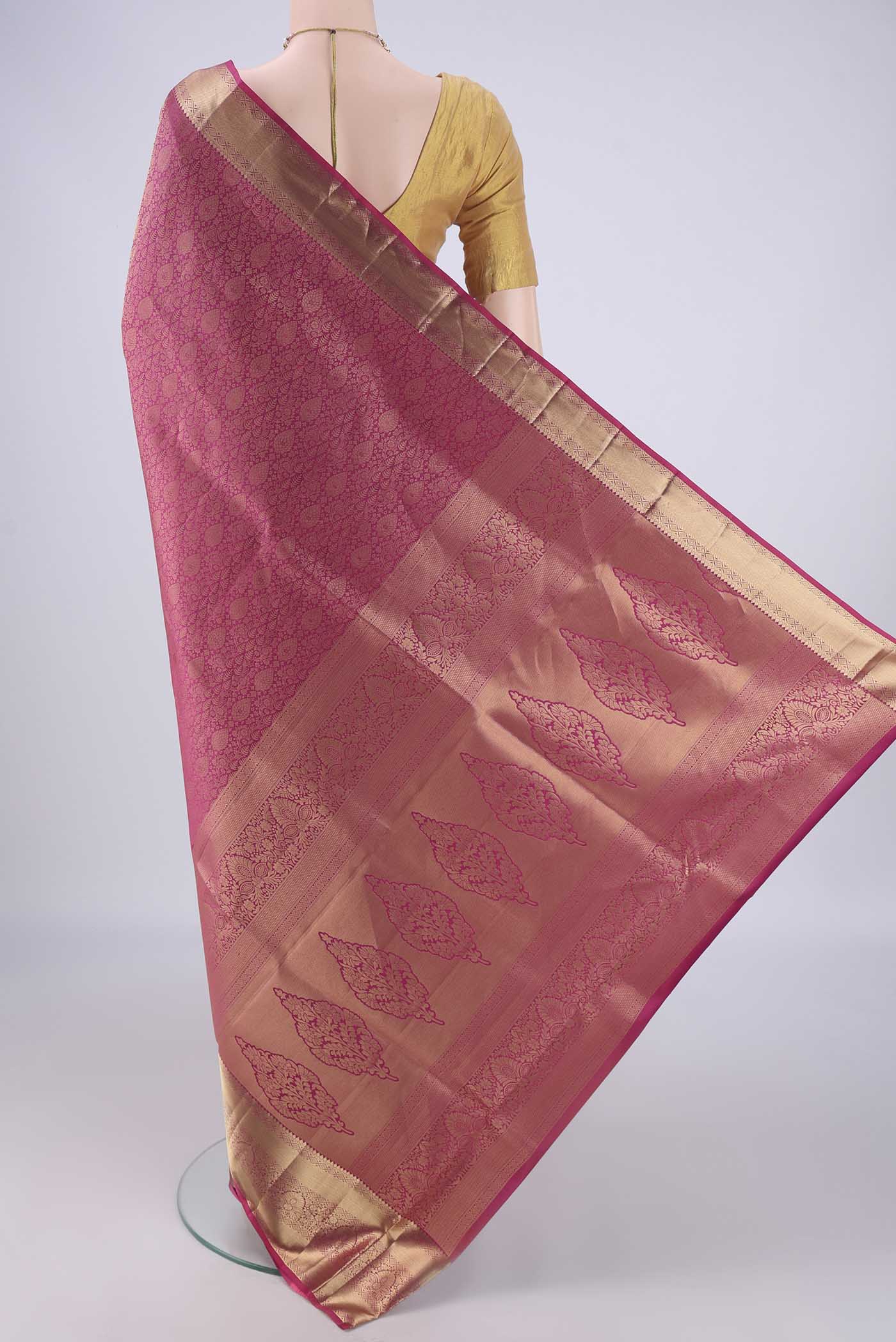 Flat view of Dark Pink Soft Silk Saree with Zari Brocade on the body and Zari Border. 