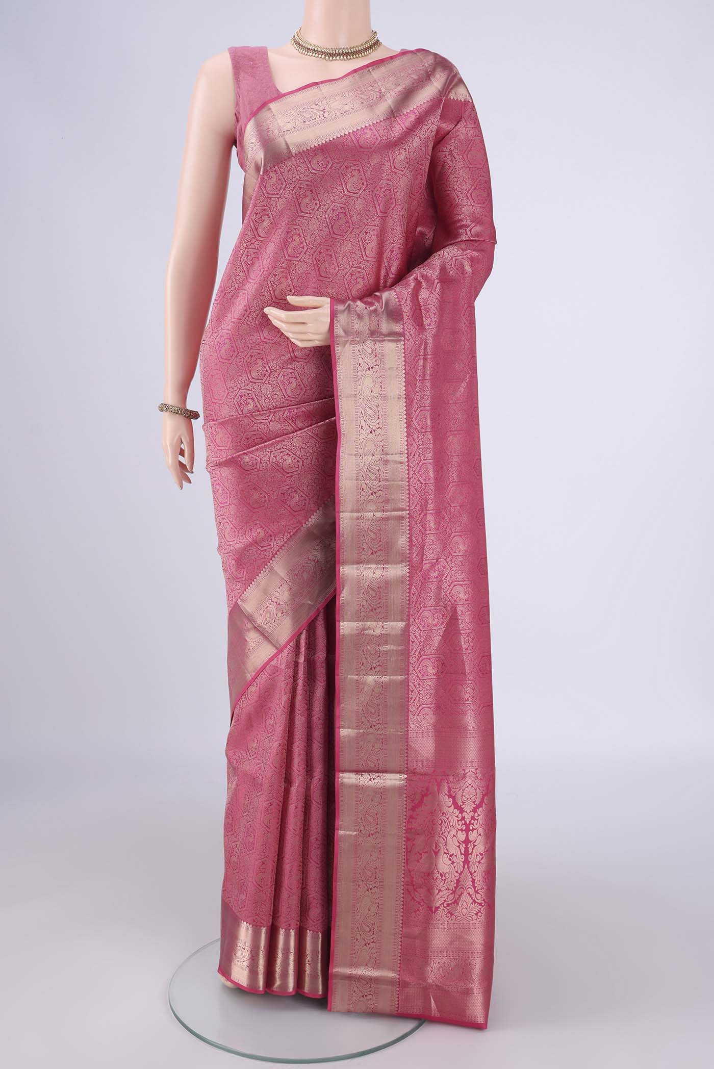 Pink Soft Silk Saree with Zari Brocade on the body and Zari Border.  displayed on a mannequin