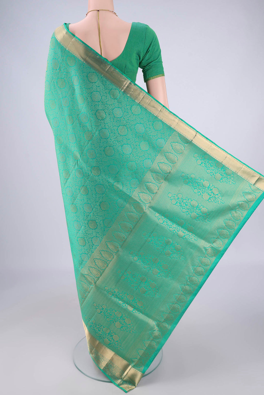 Flat view of Sea Green Soft Silk Saree with Zari Brocade on the body and Zari Border. 