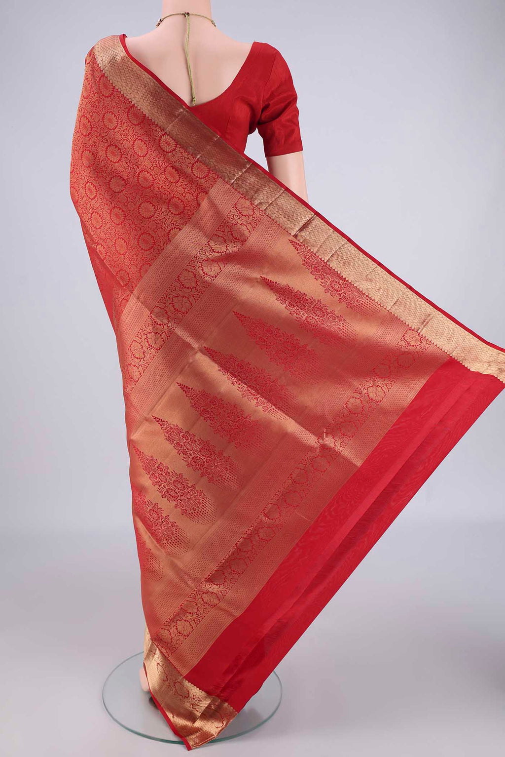 Flat view of Red Soft Silk Saree with Zari Brocade on the body and Zari Border. 