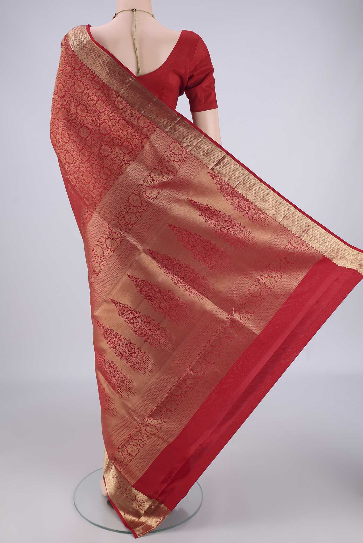 Flat view of Red Soft Silk Saree with Zari Brocade on the body and Zari Border. 