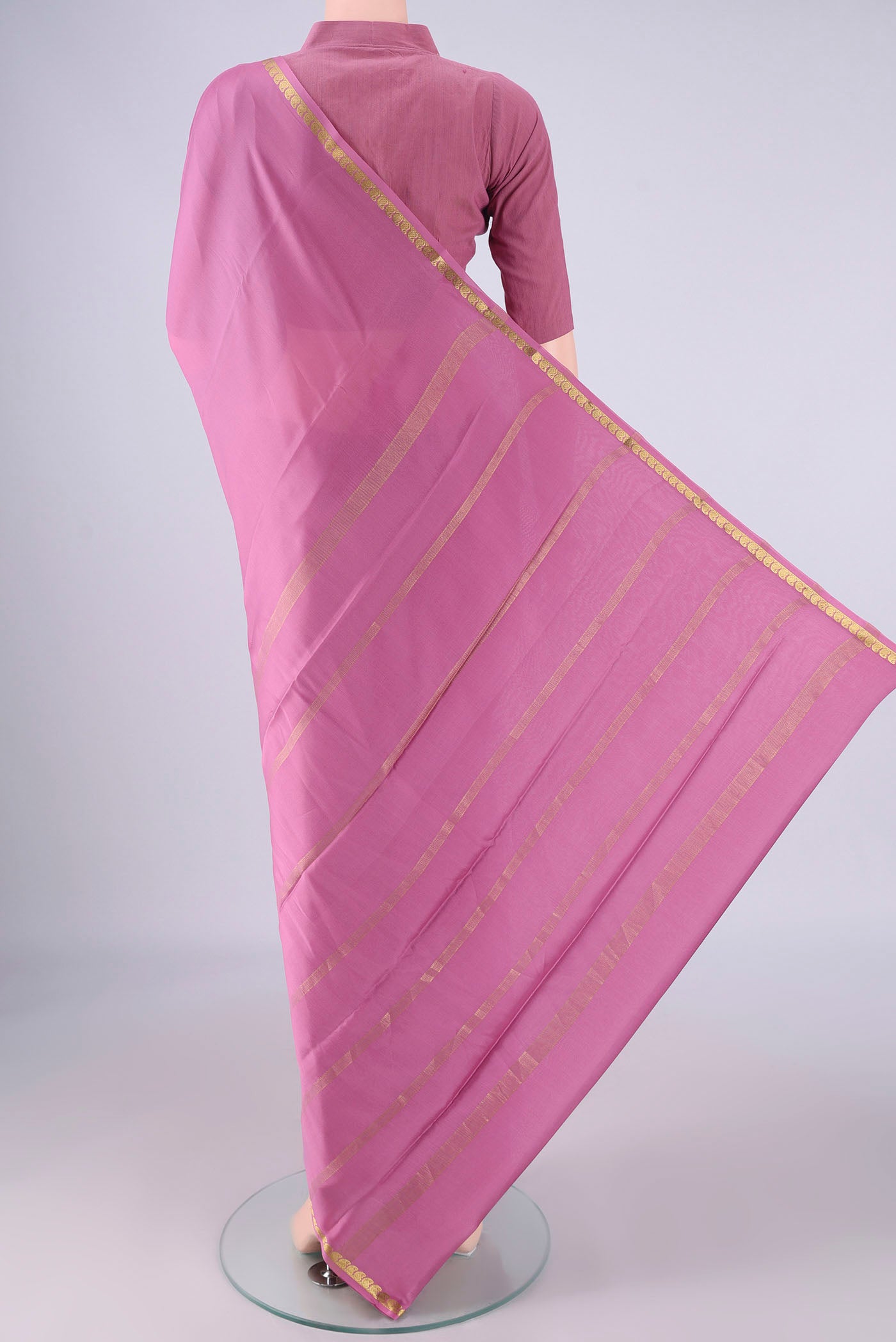 Flat view of Mauve Mysore Crepe Saree with Plain Body and Zari Border. 