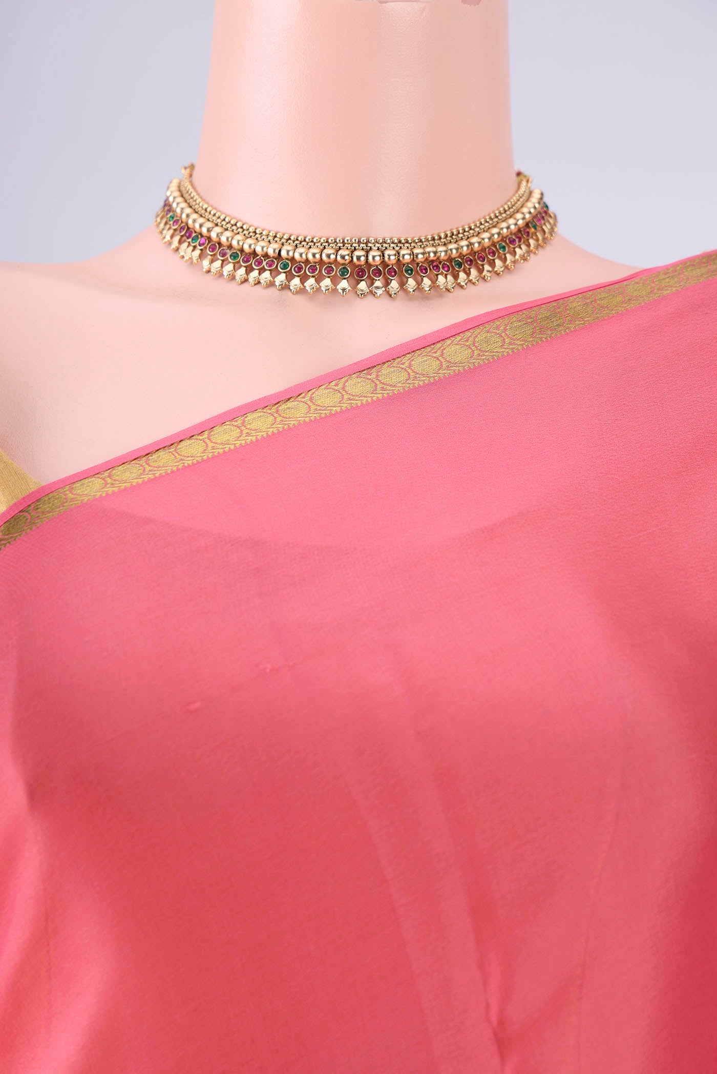 Border image of Peach Mysore Crepe Saree with Plain Body and Zari Border. 