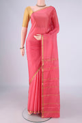 Peach Mysore Crepe Saree with Plain Body and Zari Border.  displayed on a mannequin