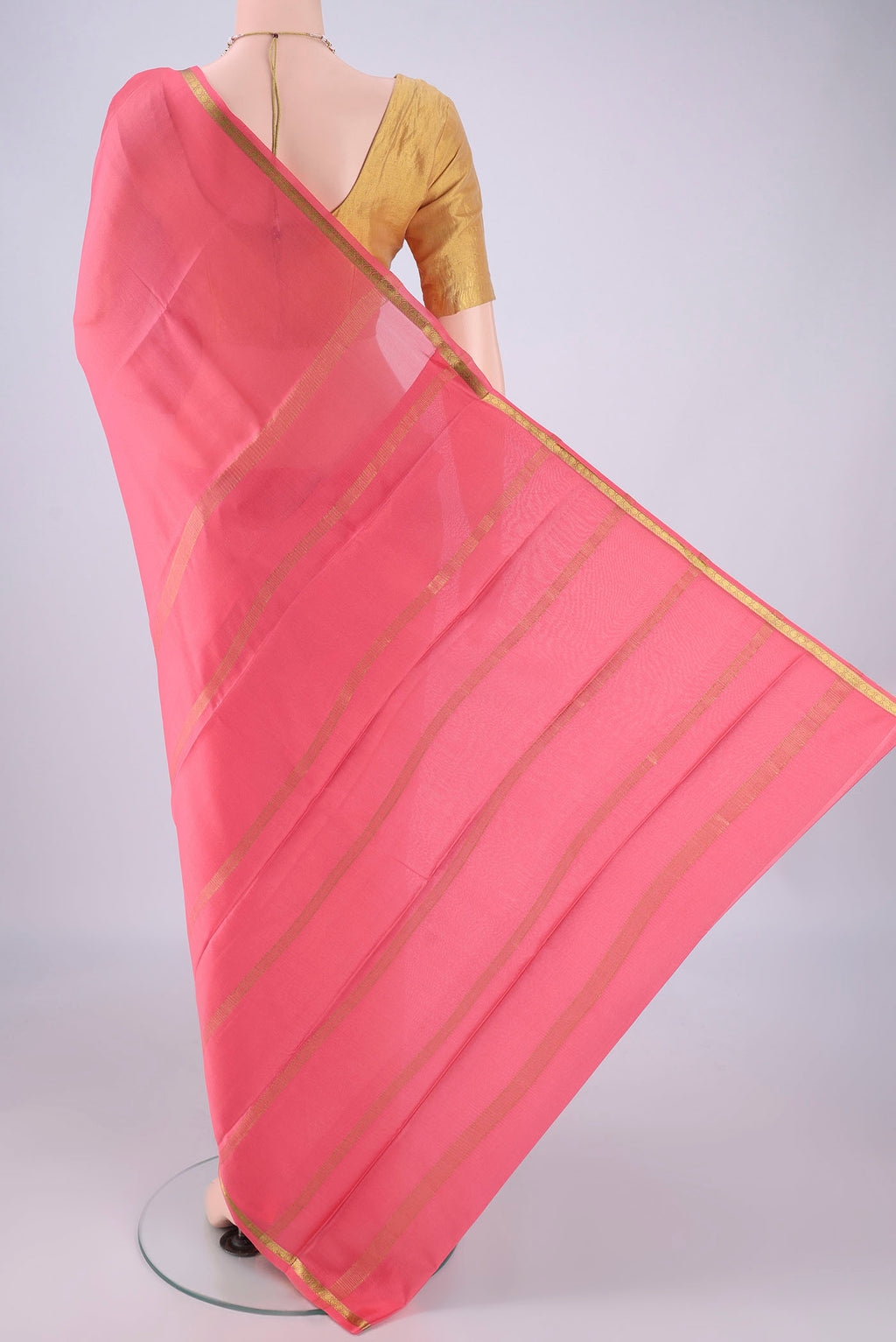 Flat view of Peach Mysore Crepe Saree with Plain Body and Zari Border. 