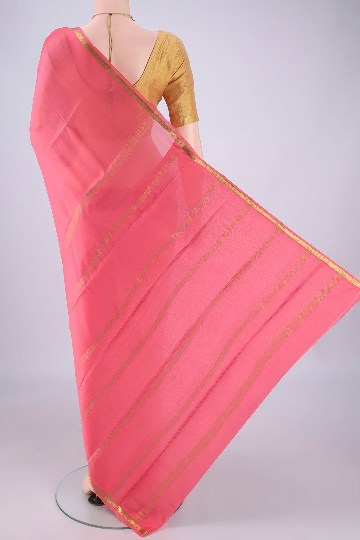 Flat view of Peach Mysore Crepe Saree with Plain Body and Zari Border. 