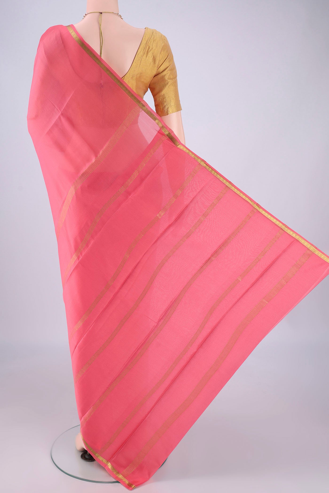 Flat view of Peach Mysore Crepe Saree with Plain Body and Zari Border. 