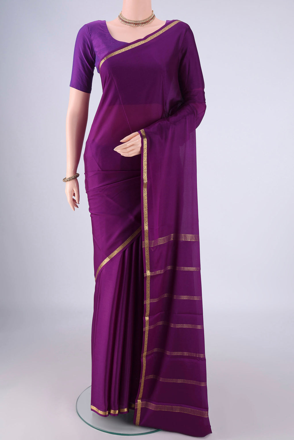 Purple Mysore Crepe Saree with Plain Body and Zari Border.  displayed on a mannequin