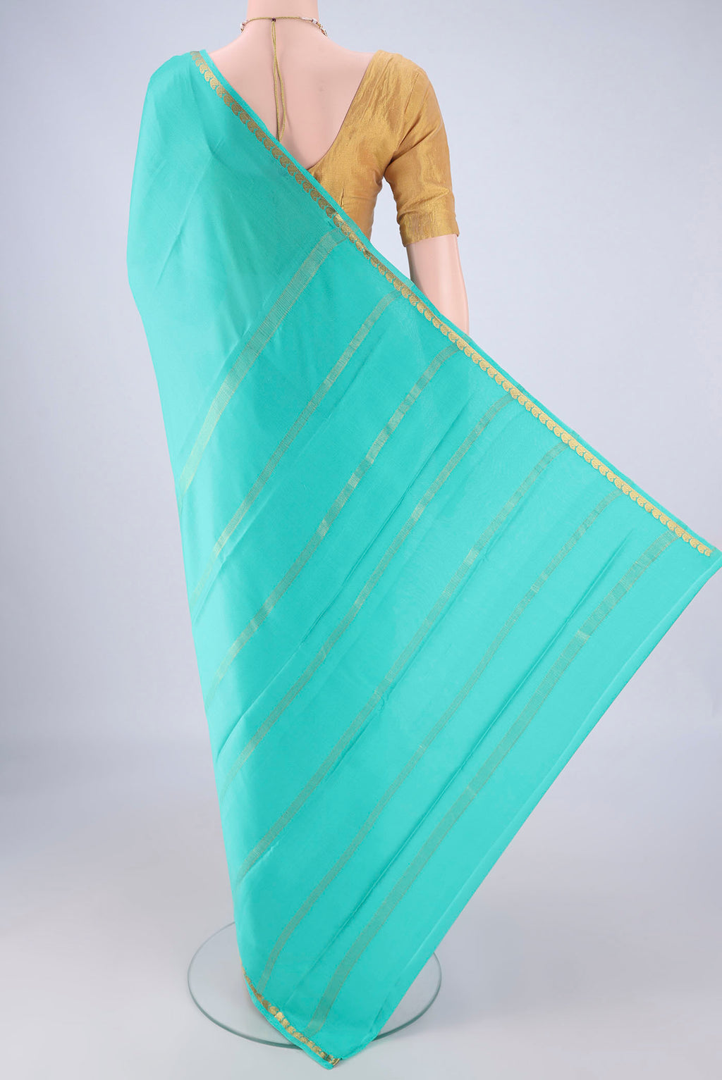 Flat view of Turquoise Mysore Crepe Saree with Plain Body and Zari Border. 