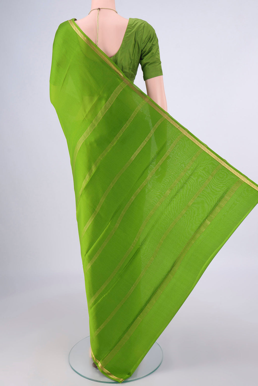 Flat view of Green Mysore Crepe Saree with Plain Body and Zari Border. 