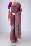 Magenta Soft Silk Saree with Jacquard design on the body and Thread Border.  displayed on a mannequin