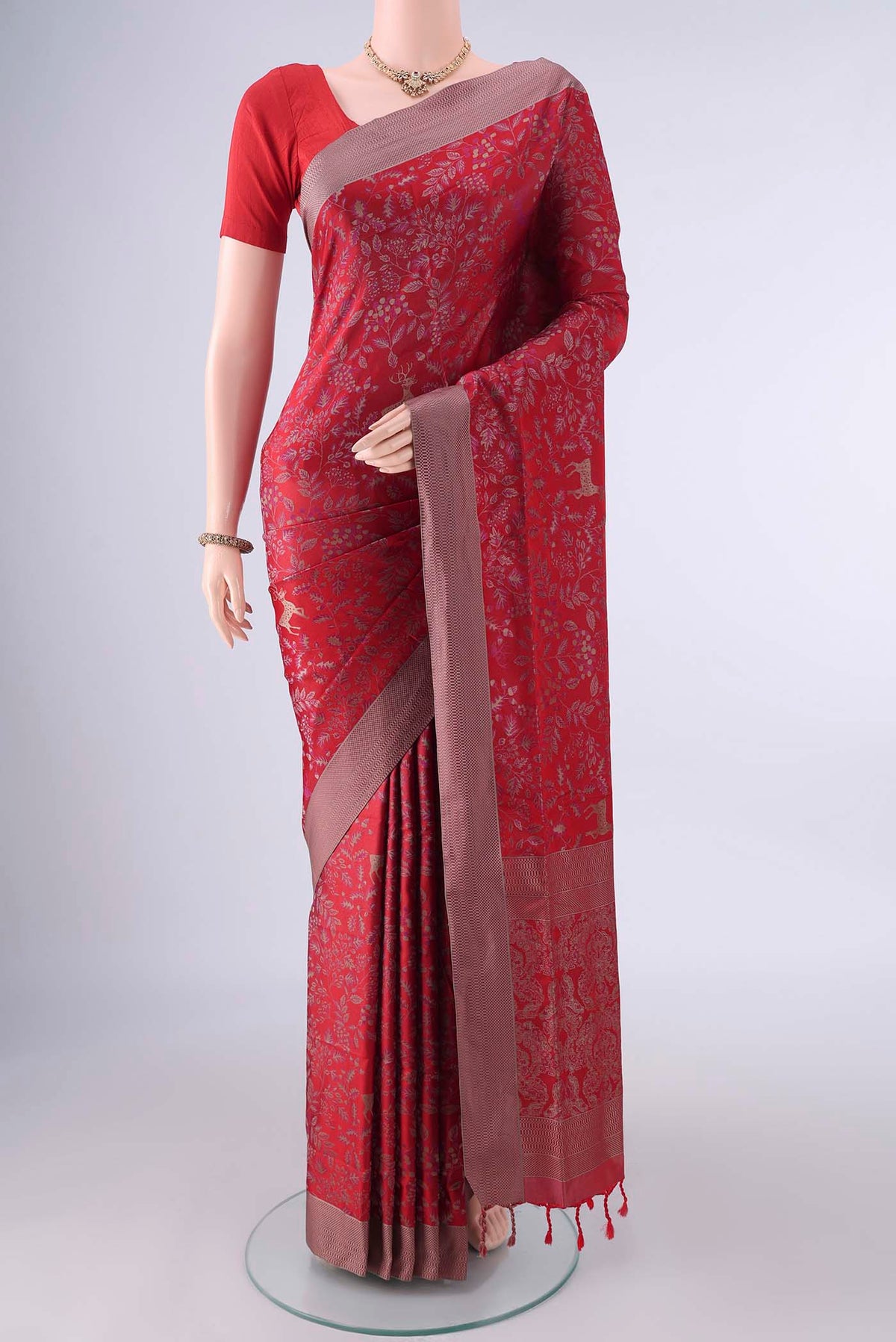 Pure Silk Red Soft Saree with Jacquard design on the body and Thread Border.  displayed on a mannequin