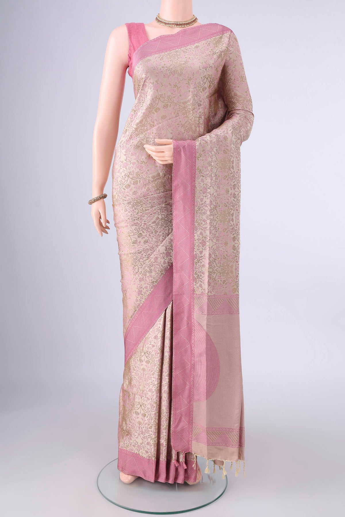 Pure Silk Beige Soft Saree with Jacquard design on the body and Thread Border.  displayed on a mannequin