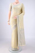 Cream Soft Silk Saree with Jacquard design on the body and Thread Border.  displayed on a mannequin
