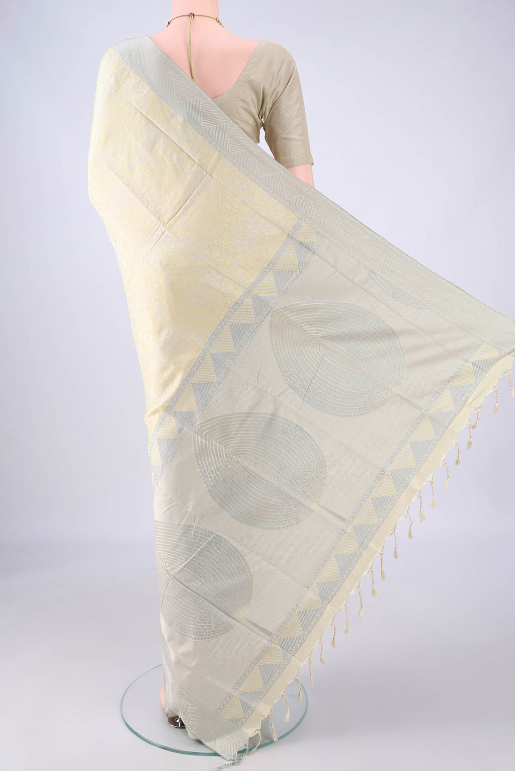 Flat view of Cream Soft Silk Saree with Jacquard design on the body and Thread Border. 