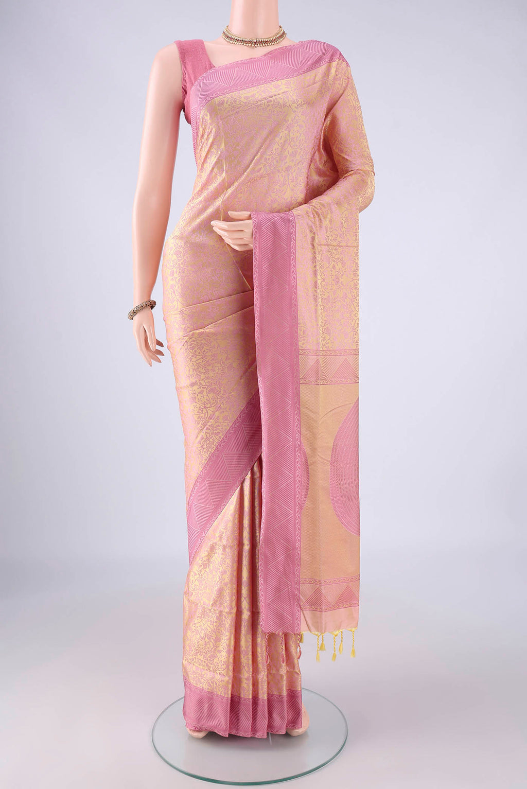 Golden Peach Dual Tone Soft Silk Saree with Jacquard design on the body and Thread Border.  displayed on a mannequin